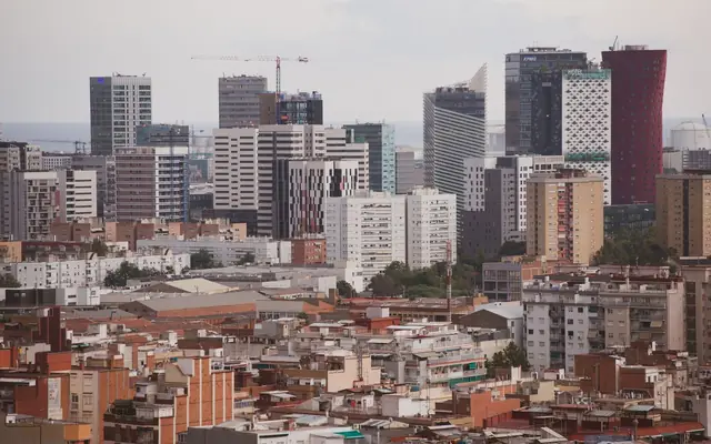 Panoramic view of Barcelona's skyline showcasing modern skyscrapers and residential buildings.