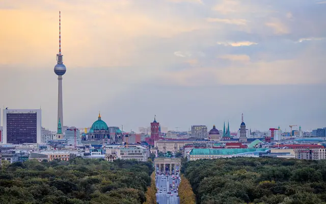 A breathtaking view of Berlin's skyline with the Fernsehturm and Brandenburg Gate.