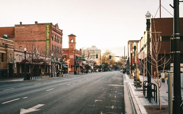 A quiet early morning on an empty street in downtown Boise, Idaho, showcasing historic architecture.