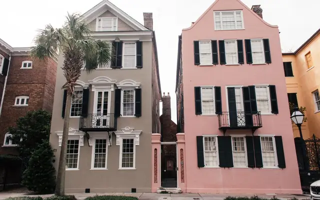 Beautiful pink and gray historic homes in Charleston's iconic neighborhood.