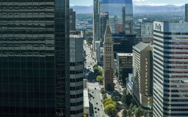 A stunning aerial view of downtown Denver showcasing the iconic clock tower amidst modern skyscrapers.