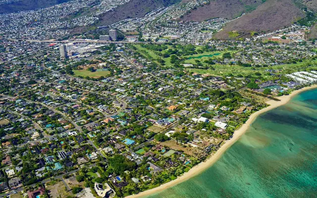 Beautiful aerial view of Honolulu's coastline showcasing cityscape and beach.