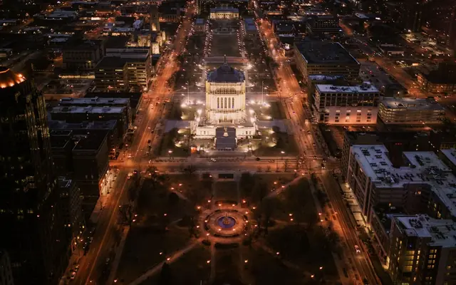 Breathtaking aerial night view of downtown Indianapolis featuring city lights and urban architecture.