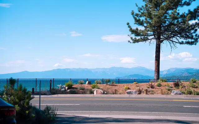 A picturesque view of Lake Tahoe with mountains and clear skies from Tahoe City, California.