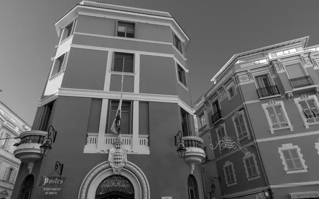 Black and white photo of Monaco's charming architectural facade highlighting classic European design.
