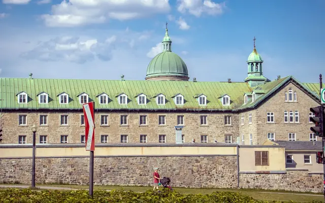 A historic building with domed roofs in Montreal, Quebec, featuring classic architectural style.