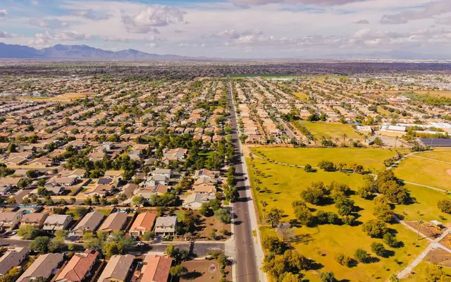 Stunning aerial view of a suburban neighborhood in Arizona with clear skies.