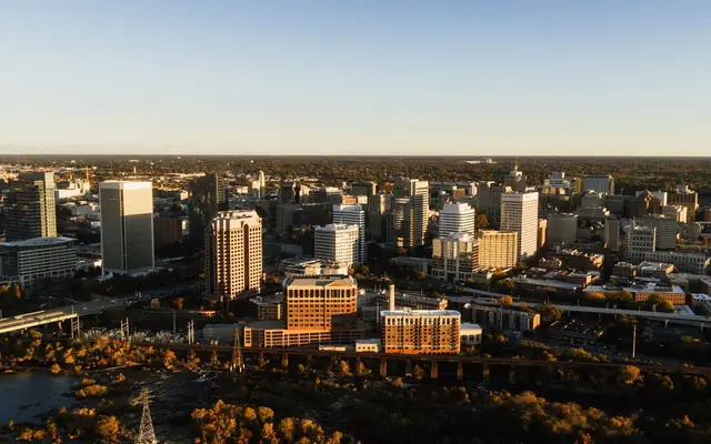 Stunning aerial view of Richmond, Virginia skyline captured at sunset with a warm glow.