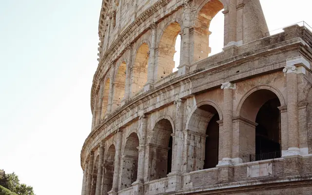 Close-up of the ancient Colosseum in Rome showcasing its majestic Roman architecture.