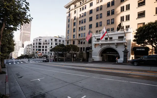 Streetscape of San Francisco featuring the Stanford Court Hotel and city architecture.