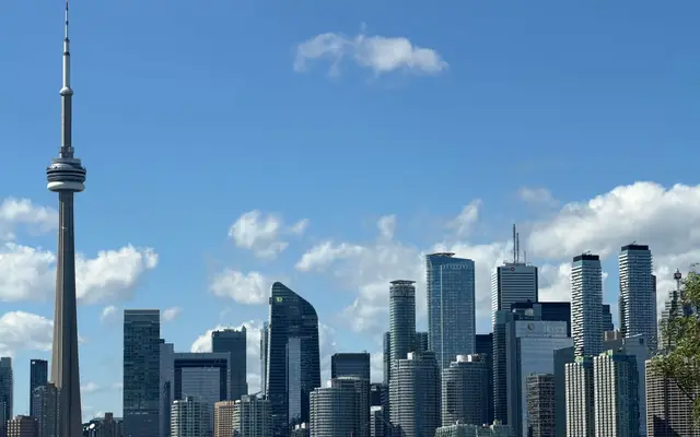 Beautiful view of Toronto's skyline featuring the iconic CN Tower on a clear day.
